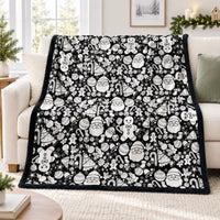 Christmas coloring blanket on a sofa